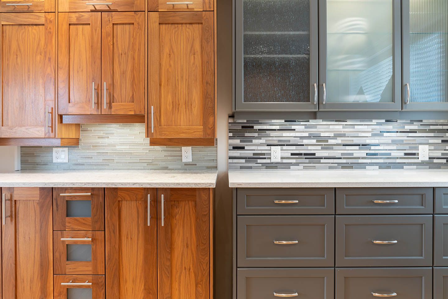 Two sets of cabinets and drawers, left one is brown and right one is grey