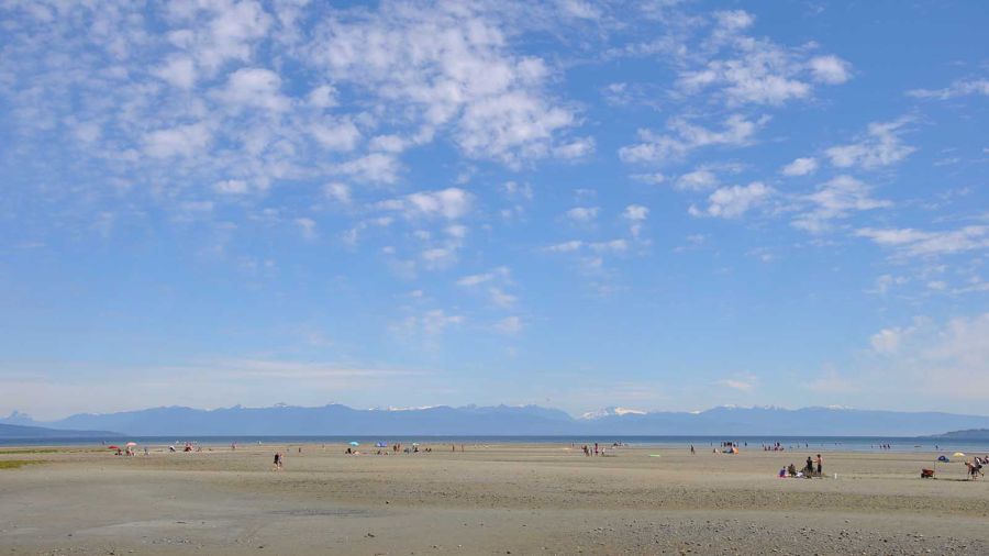Families relax on a summer's day in Parksville, BC Canada