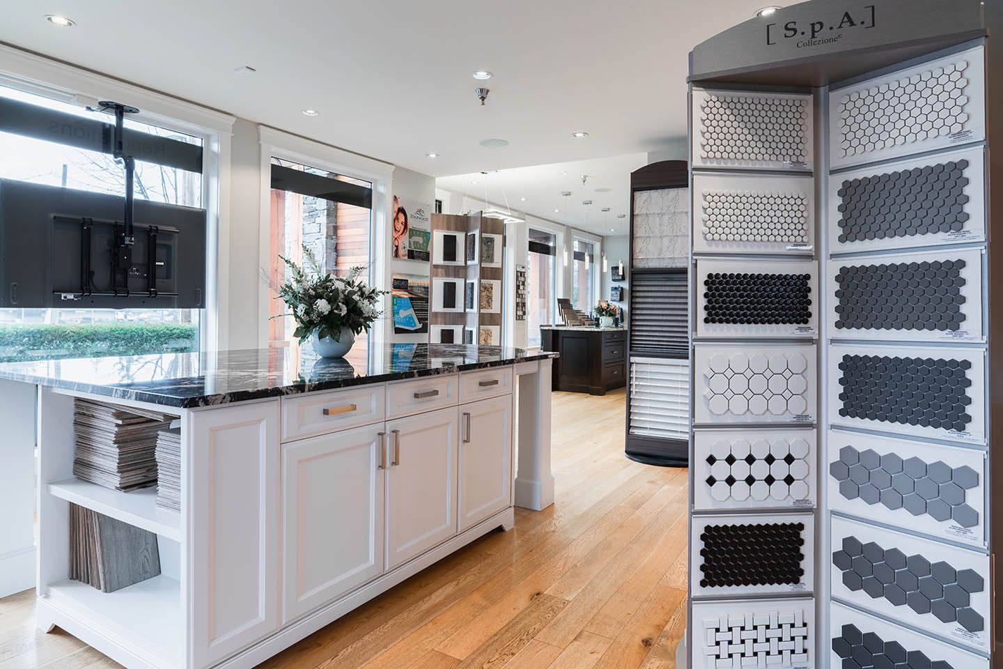 Interior of Ballard Fine Homes showroom with displays of materials