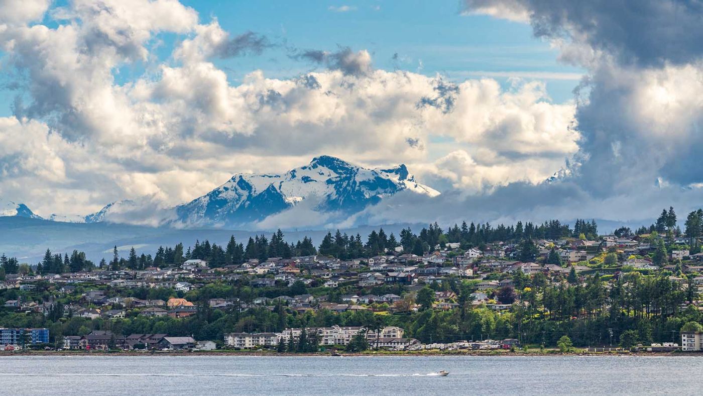 City of Campbell River with Golden Hinde mountains behind taken from Discovery Passage on cruise ship