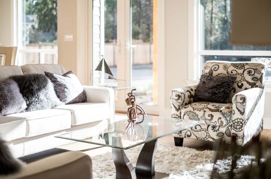 Living room with glass table and couches