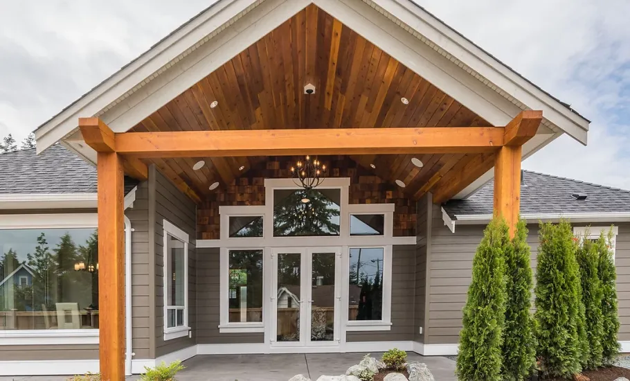 House entrance with wooden frame and several windows