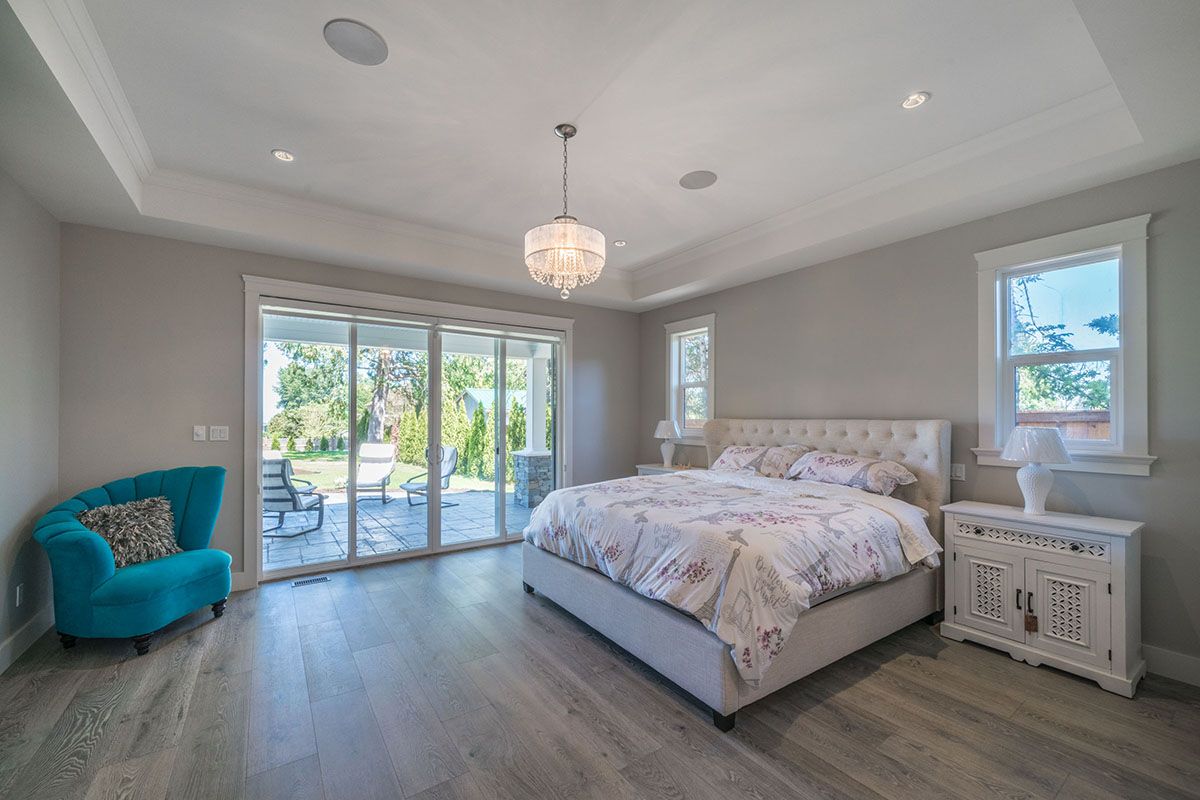 Bedroom with glass door leading to the outside