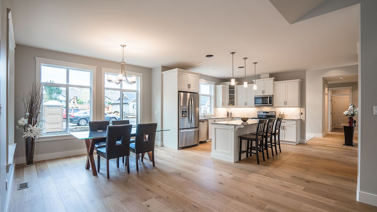 Wide view of kitchen and dining area