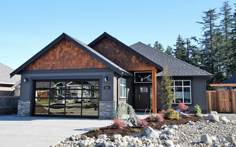 House with large glass garage door and wooden paneling