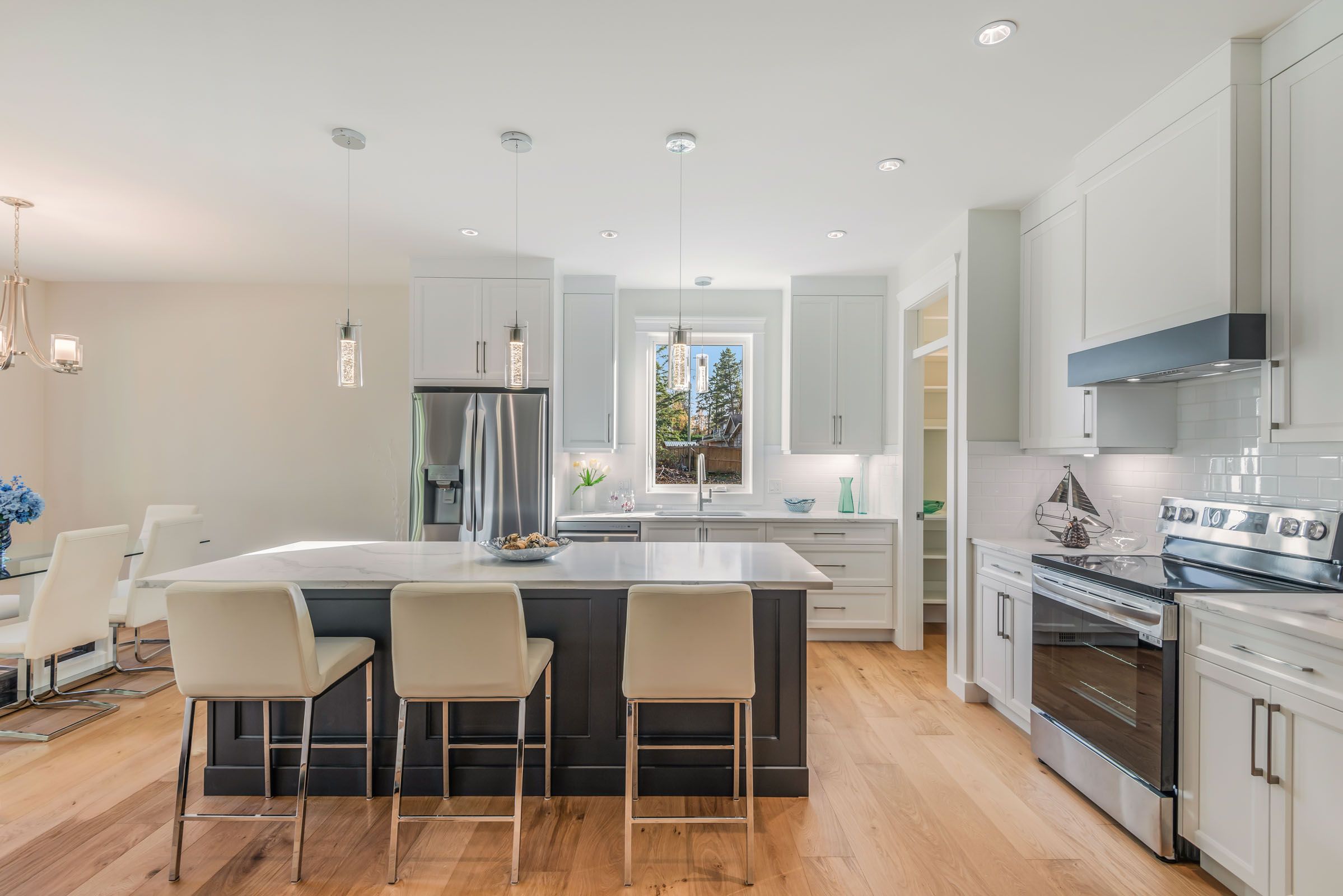 Kitchen with marble countertops and stainless steel oven.