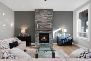 3321 Klanawa Crescent living room showcasing floor to ceiling fireplace
