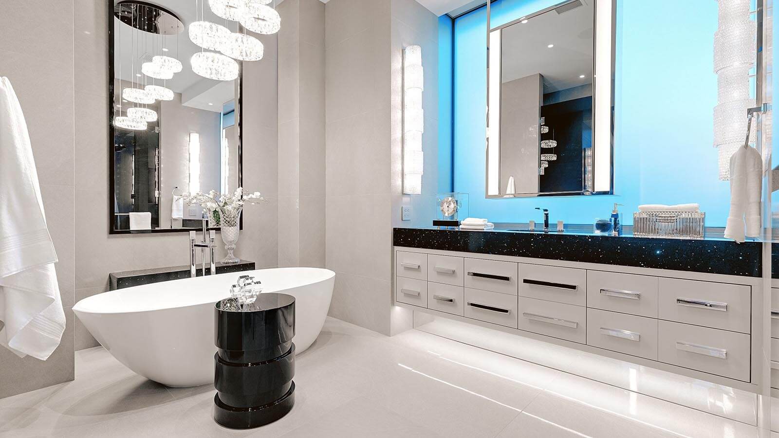 A modern bathroom design with a blue backlit wall.