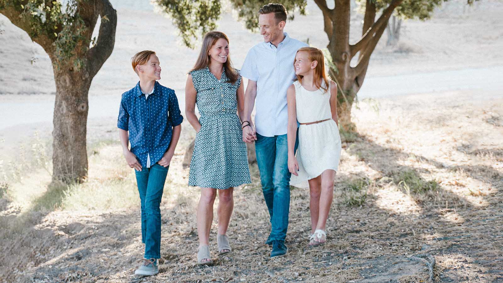 A smiling family of four