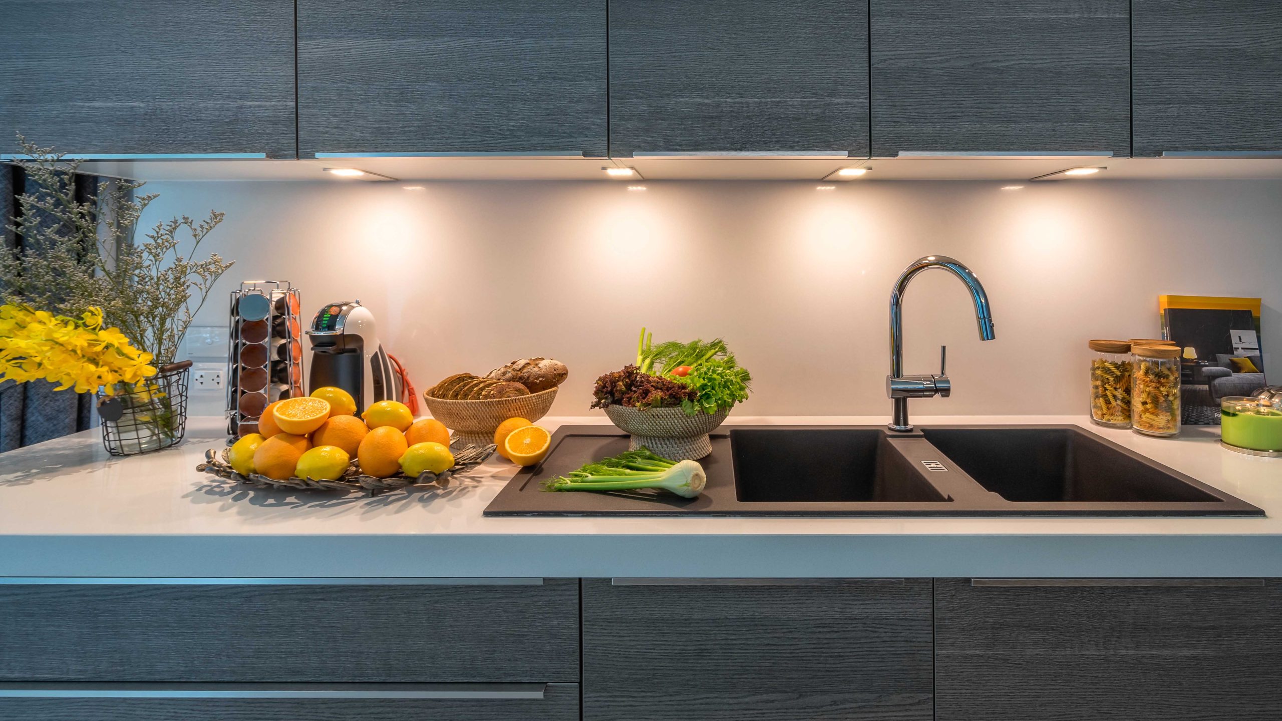 Kitchen sink in modern house kitchen with vegetables. Internal view of a modern kitchen. Interior design kitchen beautiful perspective. Quick to prepare meals.